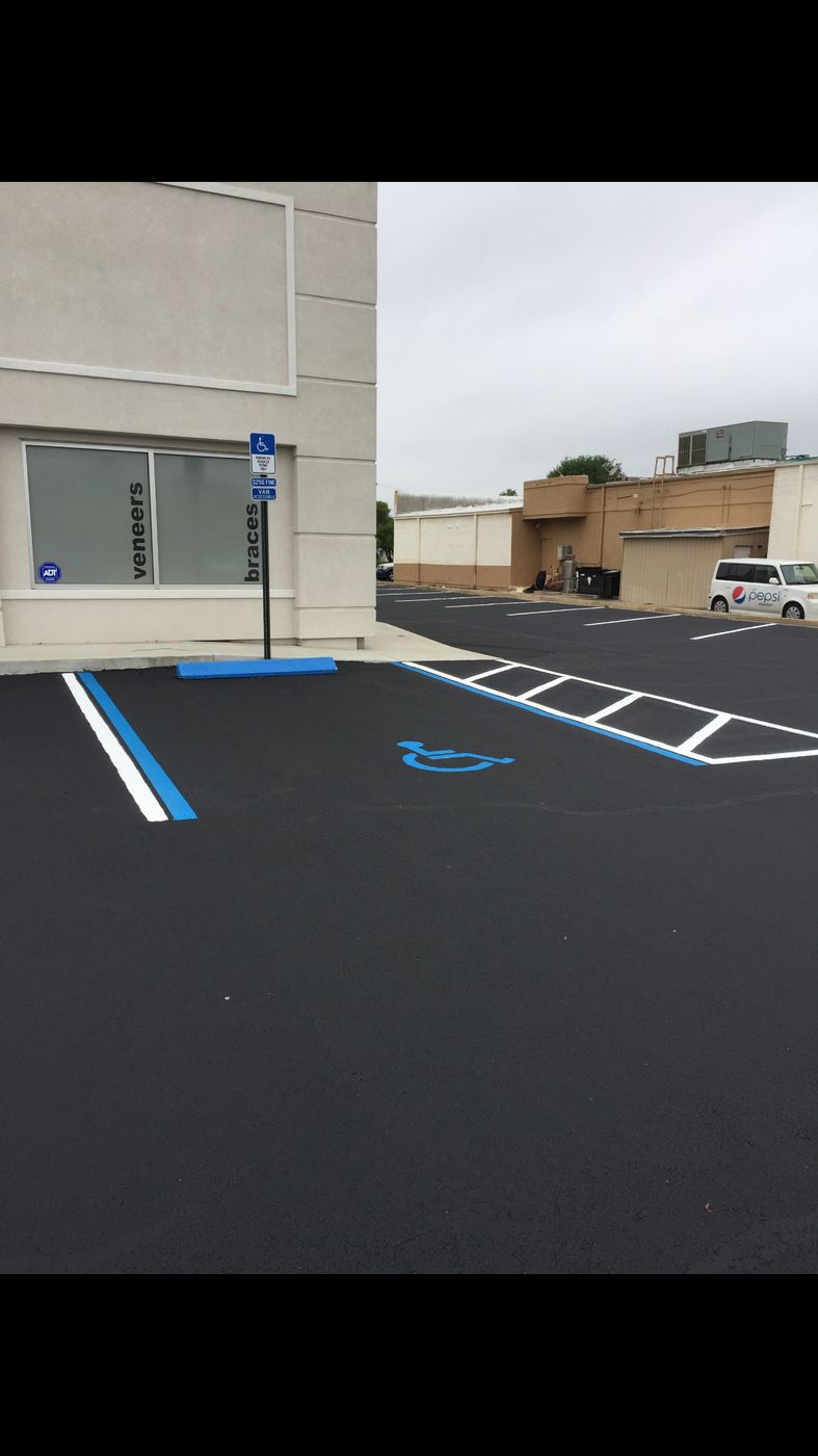 Freshly sealed lot with new ADA and stall striping