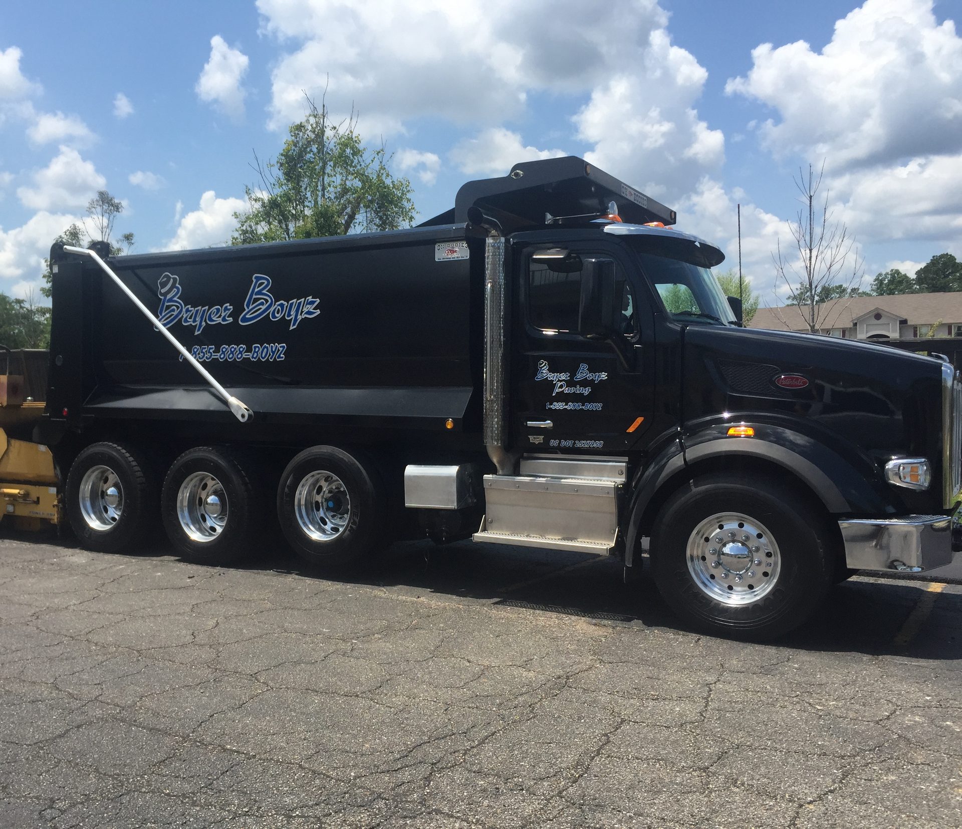 Bryerboyz Paving dump truck and paver on a job site